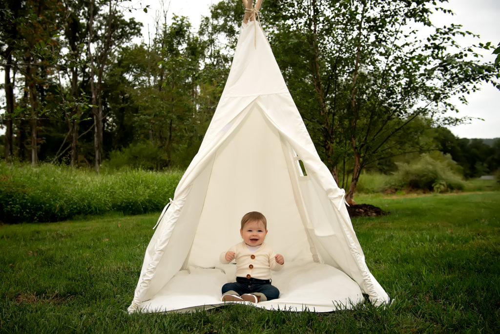 Toddler in tent outdoors