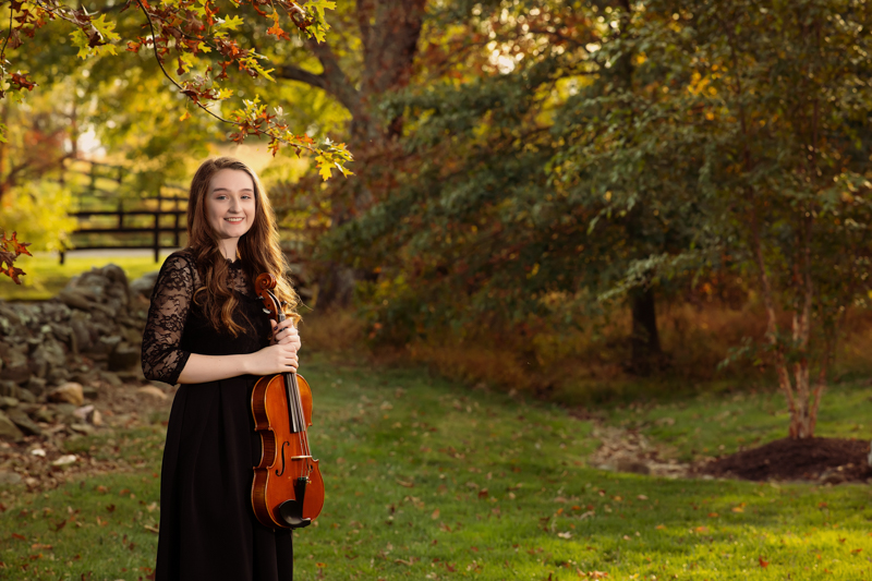 senior girl with violin outdoors