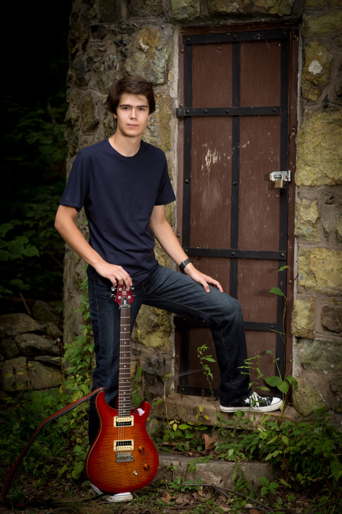 senior boy with guitar bears den