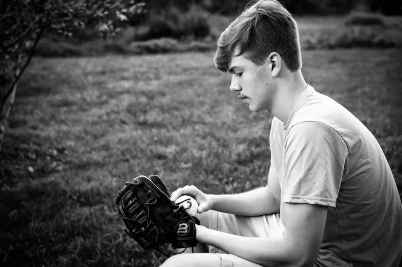 black and white senior guy with baseball glove